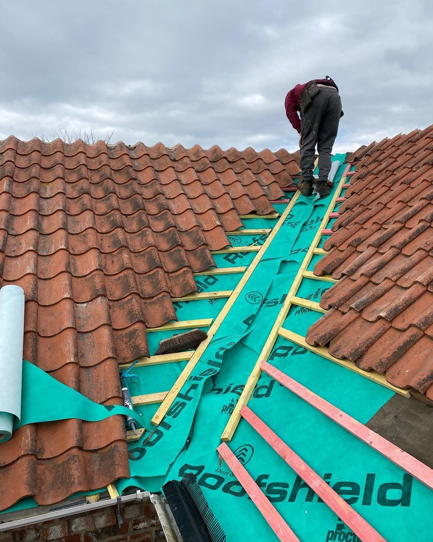 Storm-damaged roof roofing work